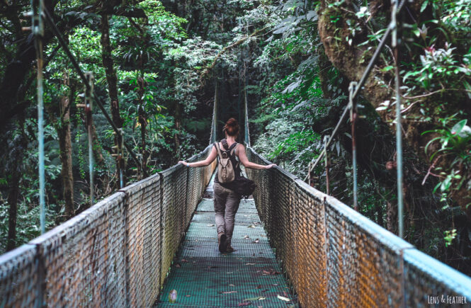 Blog author Jessi walking across a bridge in the cloud forest of Monteverde